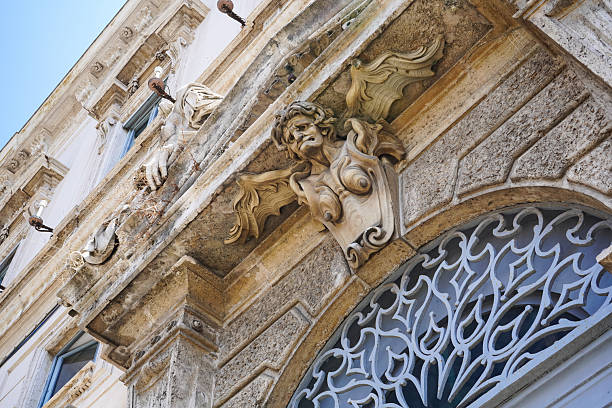 istock Ugly gargoyle angel bust sculpture over a doorway 2245062355