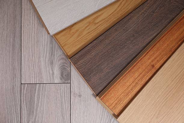 istock Different samples of wooden flooring on surface, top view. Space for text 2245065524