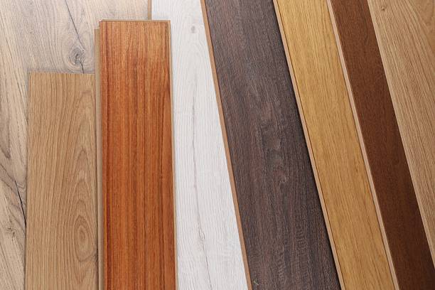 istock Different samples of wooden flooring as background, top view 2245065539