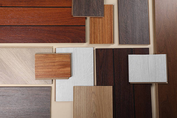 istock Different samples of wooden flooring on beige background, flat lay 2245065552