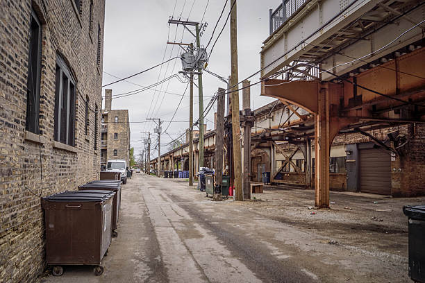 istock Chicago metro with elevated train track, power lines, garbage bins, and urban infrastructure highlighting American transit systems 2245066680