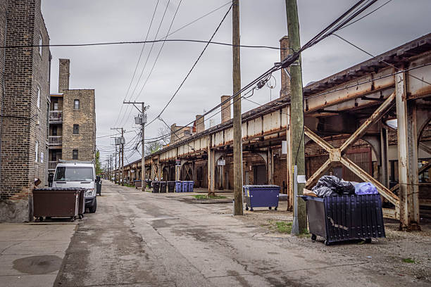 istock Chicago metro with elevated train track, power lines, garbage bins, and urban infrastructure highlighting American transit systems 2245066681