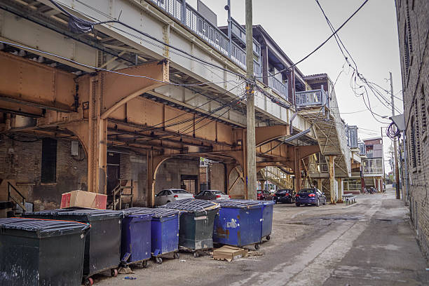 istock Chicago metro with elevated train track, power lines, garbage bins, and urban infrastructure highlighting American transit systems 2245066682