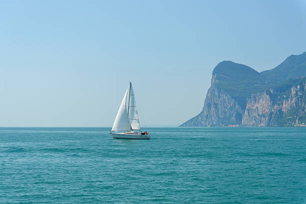 Sailboat on Lake Garda in Italy, en route from Limone sul Garda to Malcesine