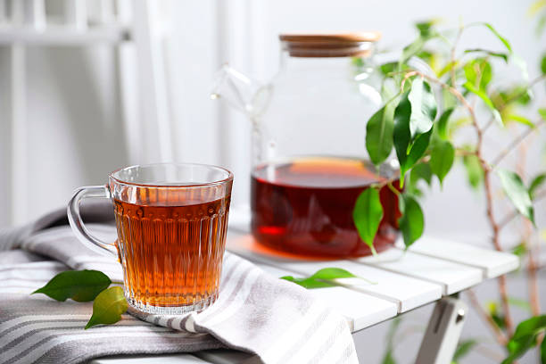 istock Tasty warm tea in cup on table, closeup 2245071196