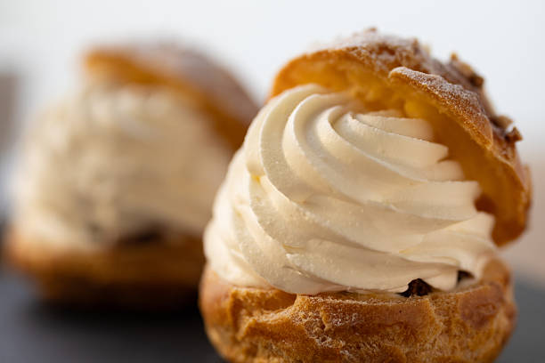 istock Cream puffs in moody lighting with afternoon sunlight 2245071573