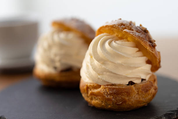 istock Cream puffs in moody lighting with afternoon sunlight 2245071590