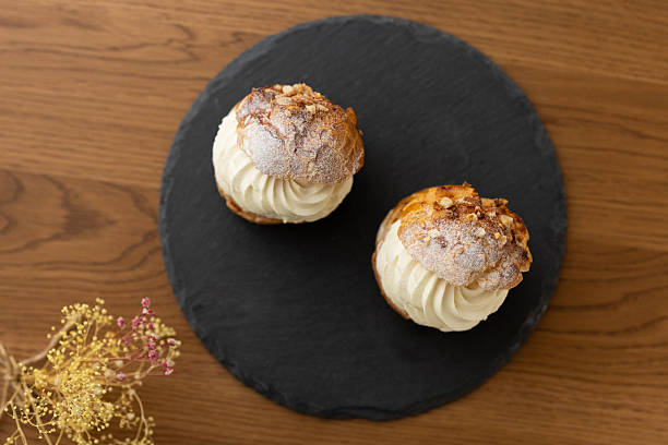 istock Cream puffs in moody lighting with afternoon sunlight 2245071597