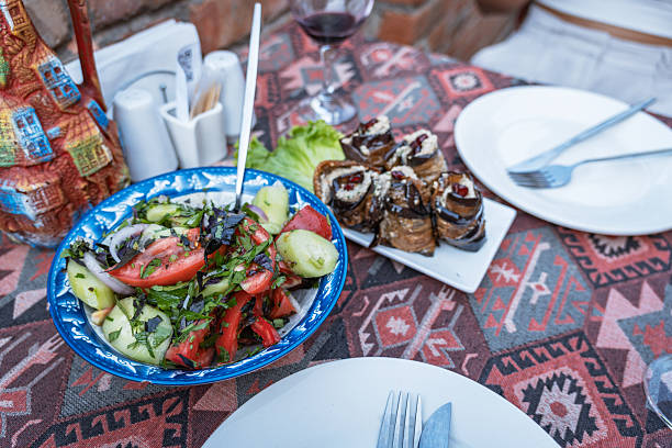istock Traditional Georgian feast with fresh salad and eggplant rolls 2245075359