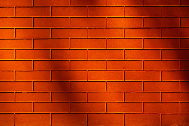 Geometric Patterned Floor with Brick Wall Background