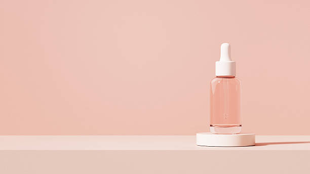 istock A single serum bottle displayed on a white matte podium with warm gentle sunlight from below. Minimal romantic tones express calm confidence, refinement, and timeless beauty. 2245077168