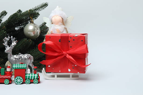 Christmas decorations on red background, flat lay. Space for text.