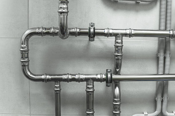 istock Metal pipe connections. Industrial abstraction. Infrastructure and maintenance concept for safety and efficiency. 2245080667
