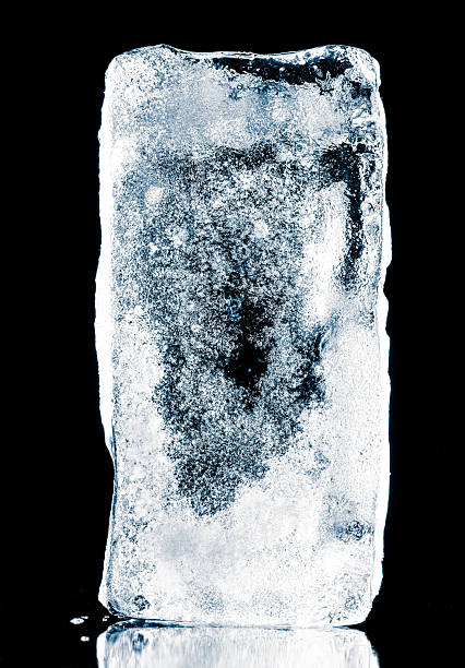 istock Natural textured ice block, covered with rime crystal structure, isolated on a black background with reflection. 2245081855
