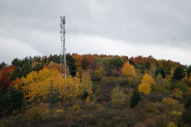 istock Telecommunication tower on autumn forest hill 2245082617