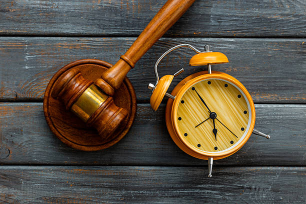 istock Alarm clock judges gavel, top view. Deadline and time management concept 2245085315
