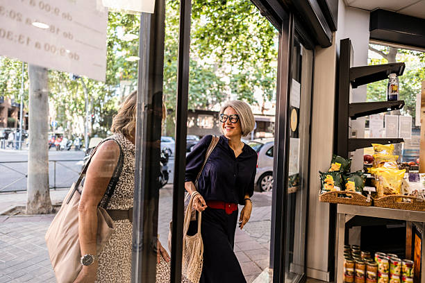 istock Two senior women entering store for shopping 2245085732