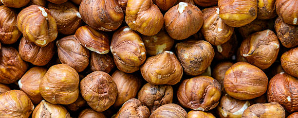 istock Hazelnuts. Close up of huzelnuts background. Top view 2245086723