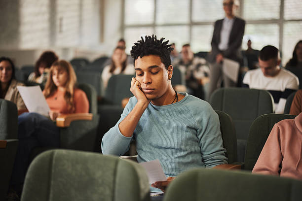 istock Displeased black student looking at his test results at lecture hall. 2245087332