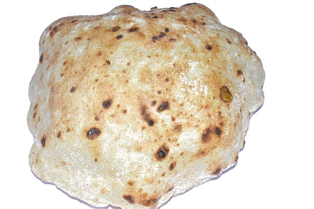 istock Traditional Egyptian flat bread with wheat bran and flour, regular Aish Baladi or Egypt bread baked in extremely hot ovens 2245094607