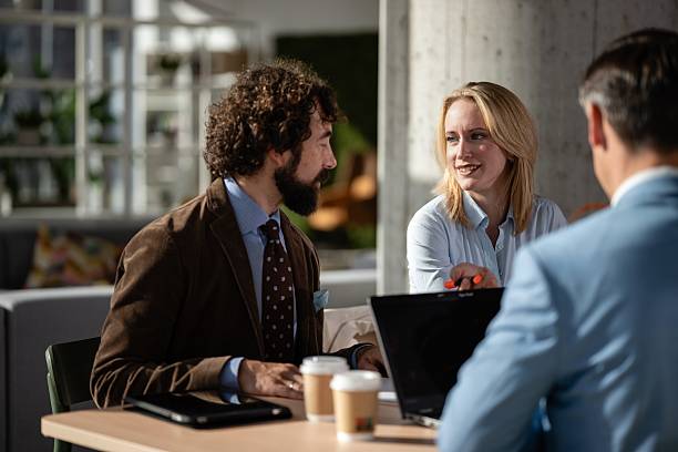 istock Business professionals discussing work at office meeting 2245097098
