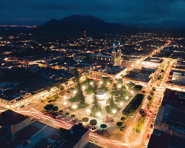 istock Vibrant city square at night with illuminated streets. 2245097365
