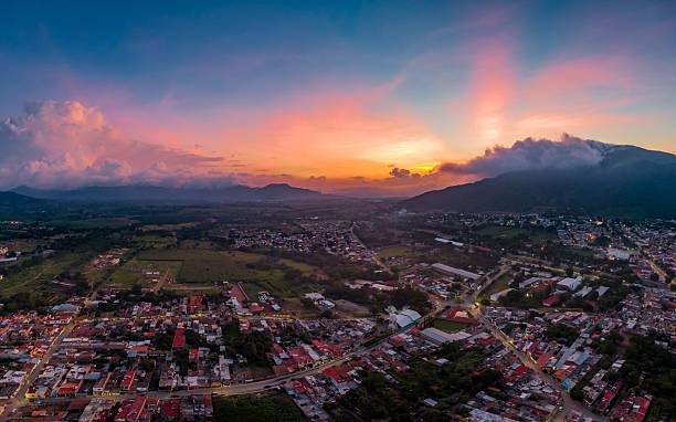 istock Aerial sunset over cityscape and mountains. 2245097382
