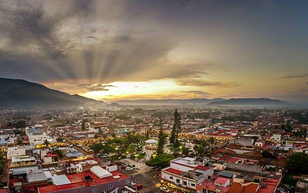 istock Aerial view of vibrant town at sunset with dramatic sun rays. 2245097454