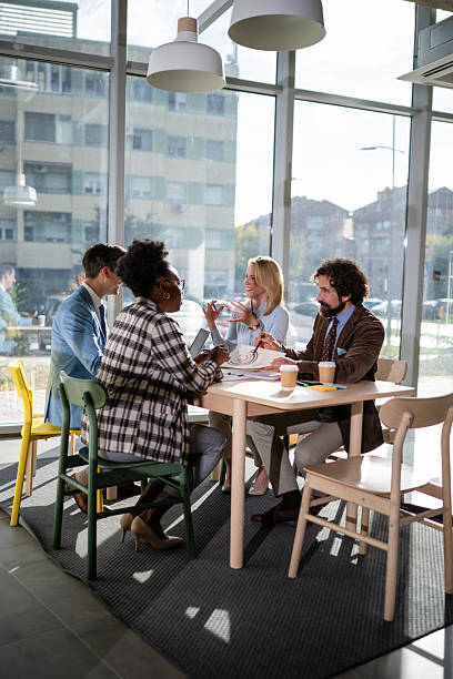 istock Diverse business team collaborating during a casual meeting 2245098353