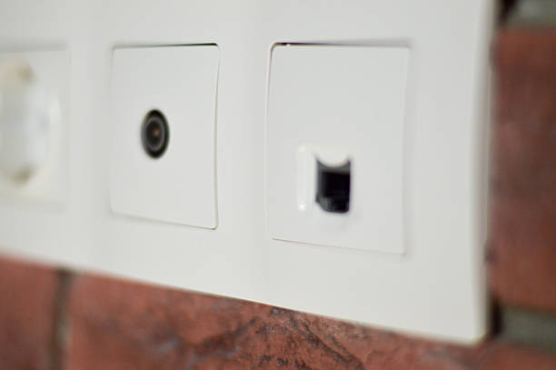 istock The image features a power outlet installed on a textured red brick wall, blending industrial style with everyday electrical needs. 2245098567