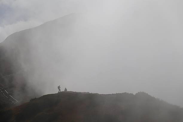 istock Misty Mountain Ridge with Distant Hikers 2245098987