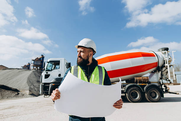 istock Construction engineer holding blueprint at concrete production plant 2245099858
