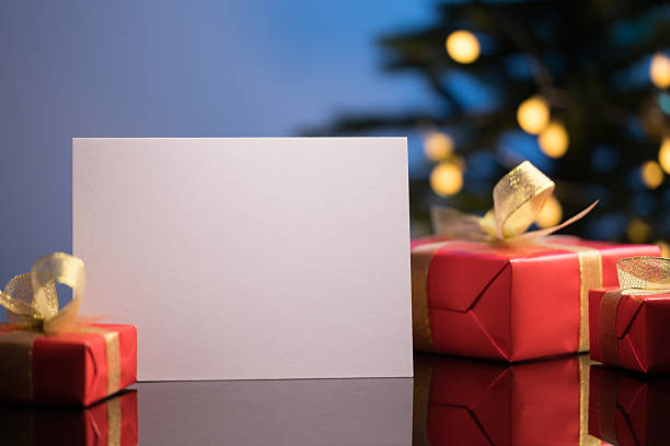 istock Christmas greeting card mockup with gifts 2245100120
