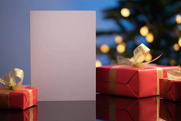 istock Christmas greeting card mockup with gifts 2245100124