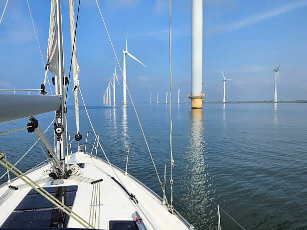 istock Windturbines in the water, producing alternative green energy 2245100645