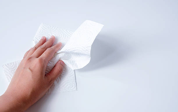 istock Hand wiping table with kitchen paper towel 2245103454