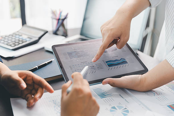 istock Business meeting, data analytics or women with graph presentation in office. Chart, analysis accounting team brainstorming economy, inflation or solution. business project finance investment concept. 2245104940