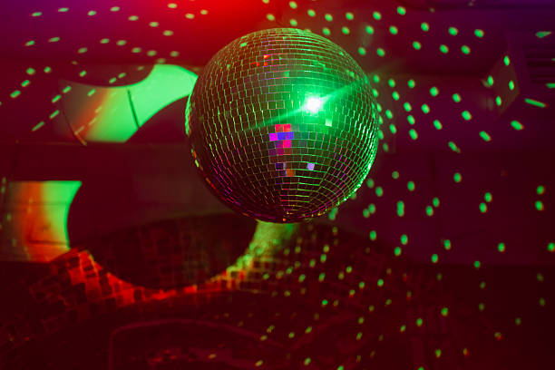 istock Party disco mirror ball reflecting purple lights. 2245106744