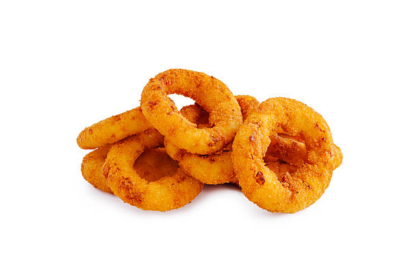 istock Crispy fried onion rings stacked on a white background ready to enjoy 2245106843