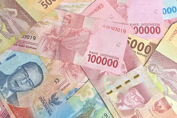 istock indonesia rupiah banknote arranging on wooden table texture and background them 2245108379