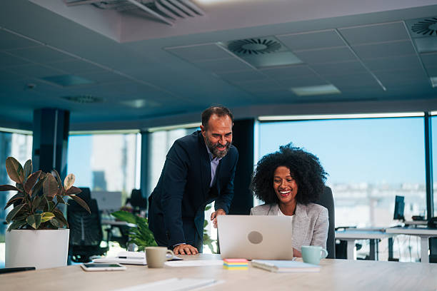 istock Business colleagues collaborating on laptop in modern office 2245108492