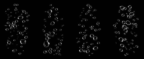 istock Four realistic streams of air bubbles rising underwater on a black background, ideal for refreshing beverage ads, clean water concepts, and digital motion effects. Perfect for cinematic visual design. 2245108868
