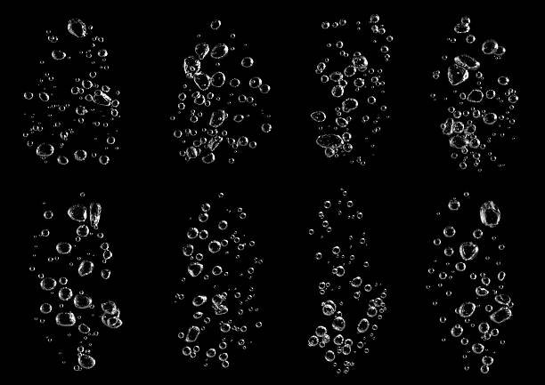 istock Multiple streams of realistic air bubbles rising underwater on a black background, perfect for clean design, beverage ads, and motion graphic effects. Ideal for digital artwork and cinematic visuals. 2245108871