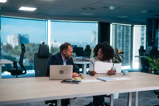 istock Business colleagues collaborating on project in modern office 2245109109