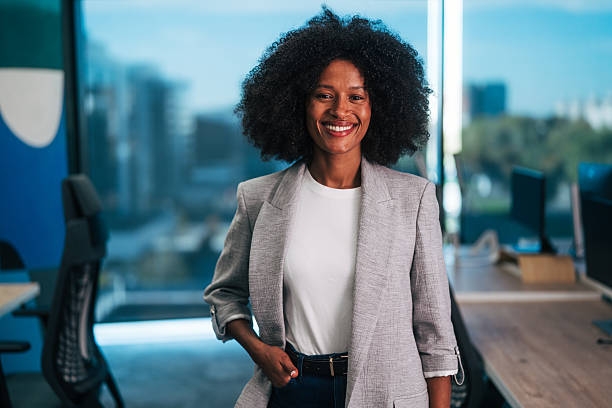 istock Happy black businesswoman standing in modern office 2245109143