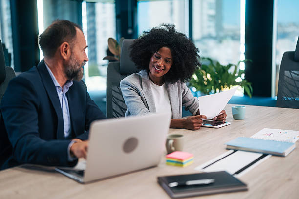 istock Diverse business partners collaborating during office meeting 2245109183