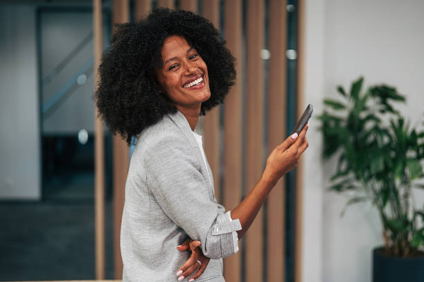 istock Happy businesswoman using smartphone connecting with clients 2245109940