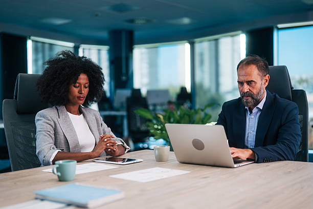 istock Diverse business people collaborating in modern office meeting 2245110199