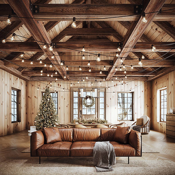 Cozy rustic living room decorated for Christmas with warm string lights, a beautifully adorned Christmas tree, and elegant holiday wreath.