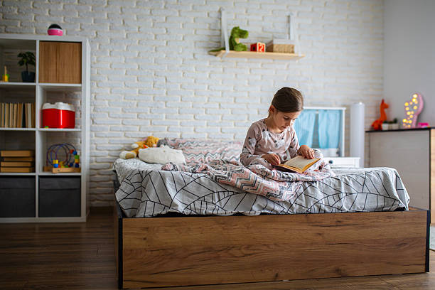 istock Peaceful Morning Reading Time for a Little Girl 2245111607